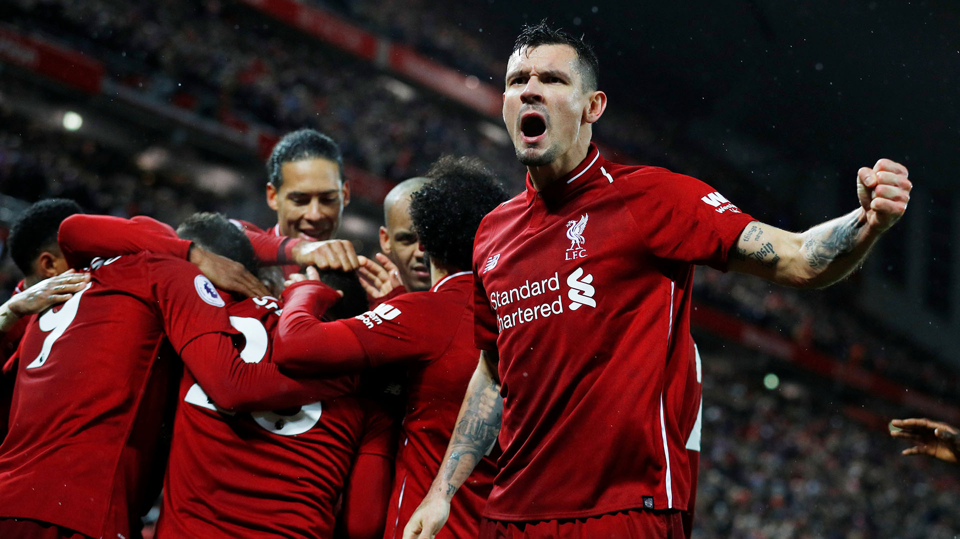 Soccer Football – Premier League – Liverpool v Manchester United – Anfield, Liverpool, Britain – December 16, 2018  Liverpool’s Xherdan Shaqiri celebrates scoring their third goal with Dejan Lovren and team mates  REUTERS/Phil Noble  EDITORIAL USE ONLY. No use with unauthorized audio, video, data, fixture lists, club/league logos or “live” services. Online in-match use limited to 75 images, no video emulation. No use in betting, games or single club/league/player publications.  Please contact your account representative for further details.