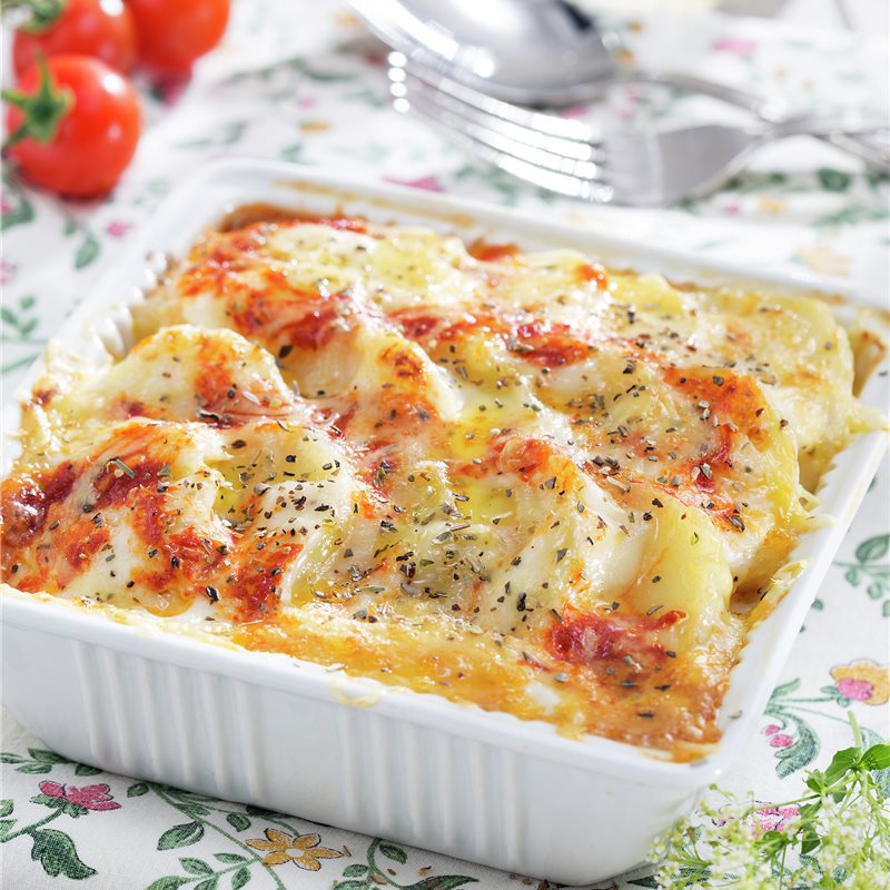 Patata gratinada con queso, jamón y huevos