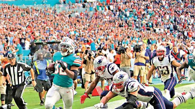 Miami gana con drama a los Patriotas